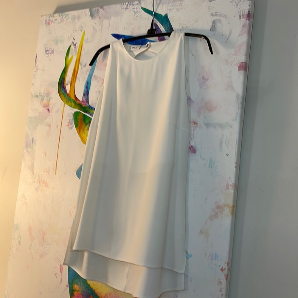 Akris designer top. Streamlined and minimalist. Neutral crème color.